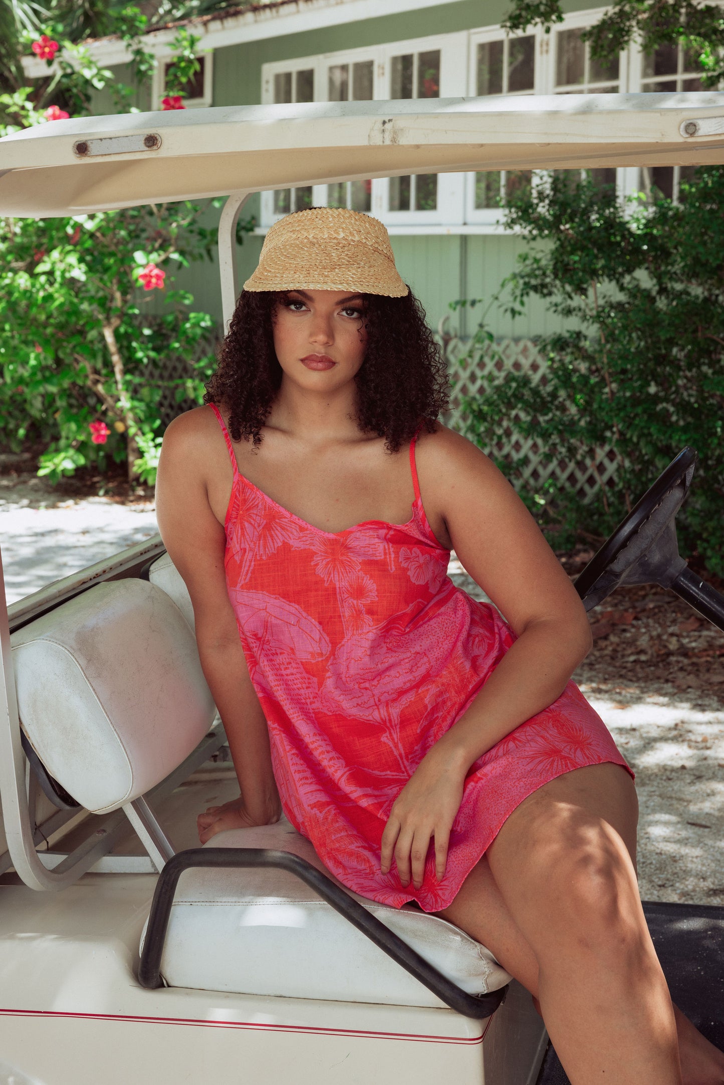Woman in tropical print slip