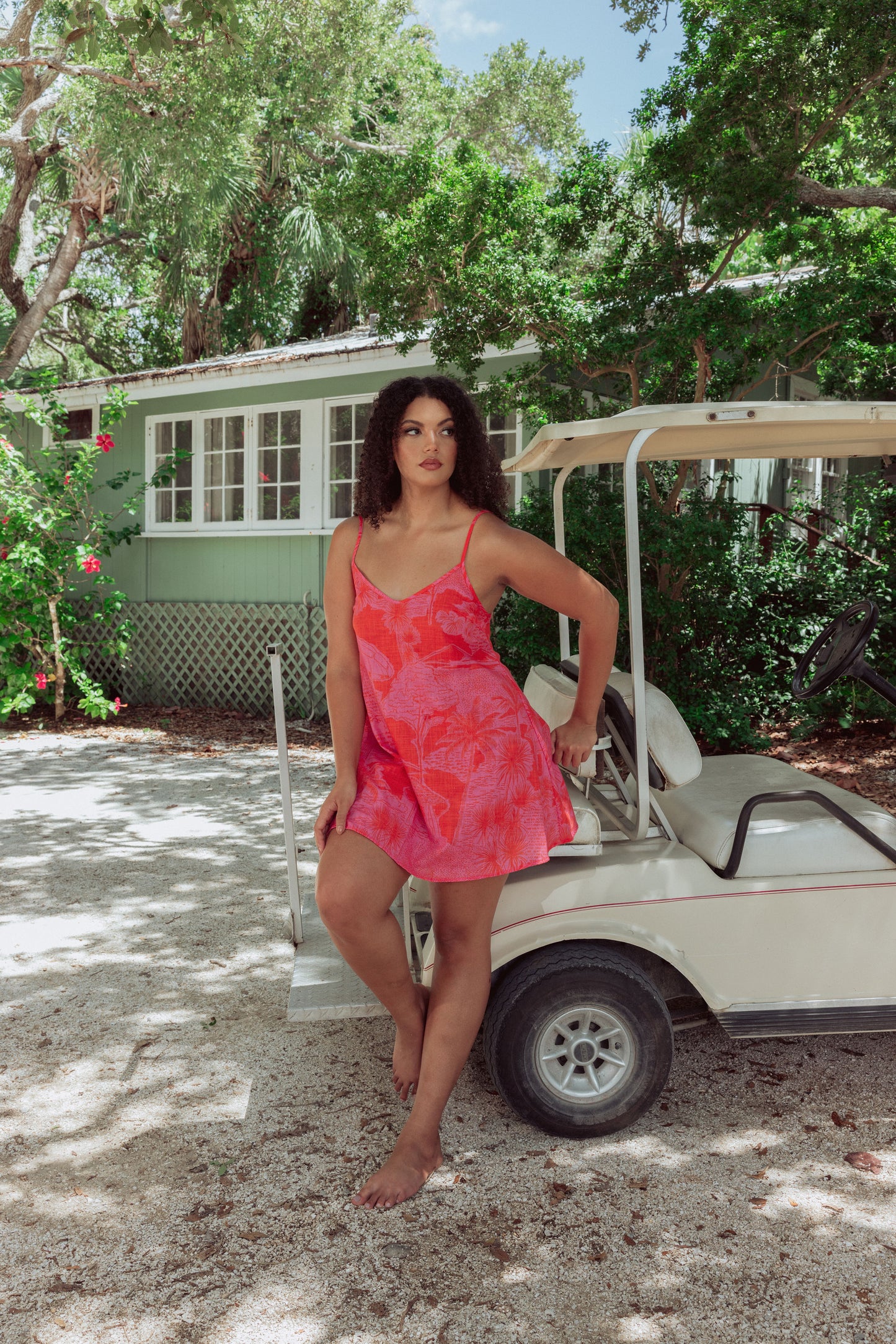 Woman in tropical print slip