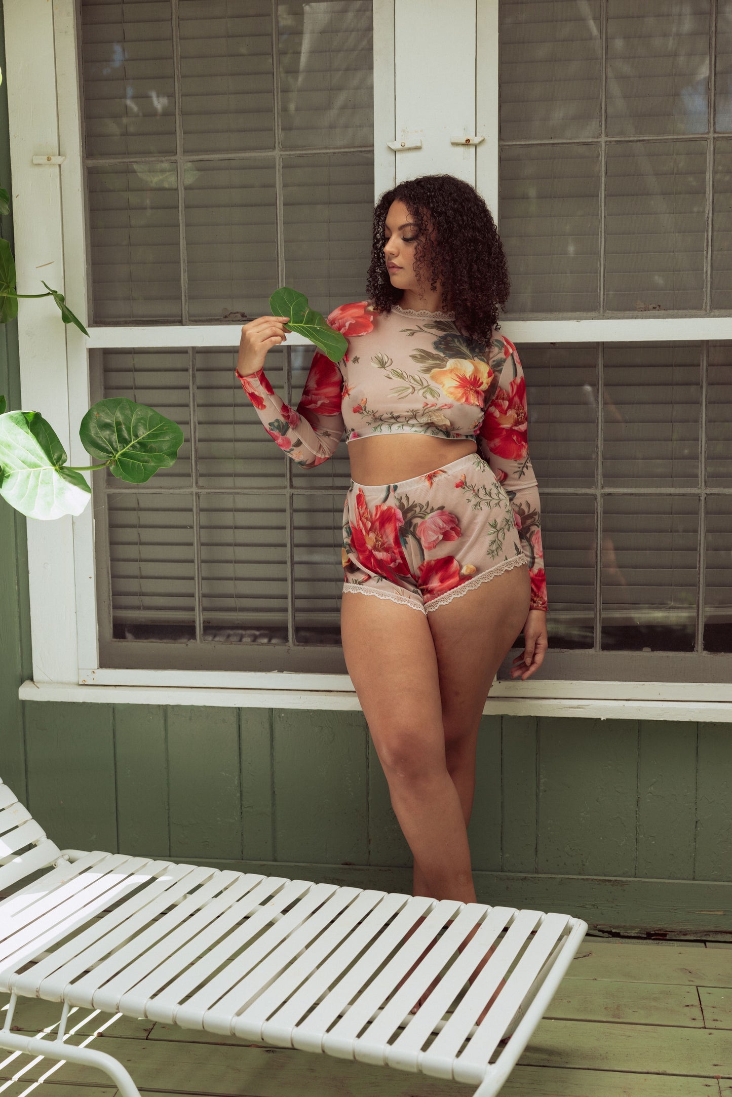 Woman in mesh floral lounge set