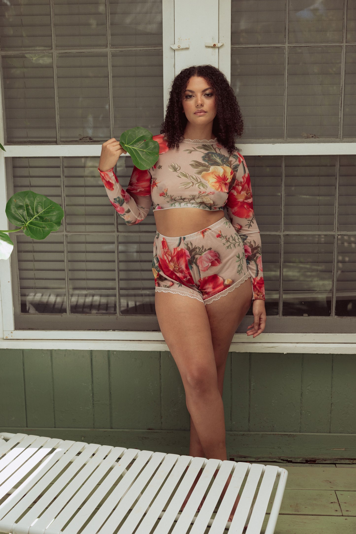 Woman in mesh floral lounge set