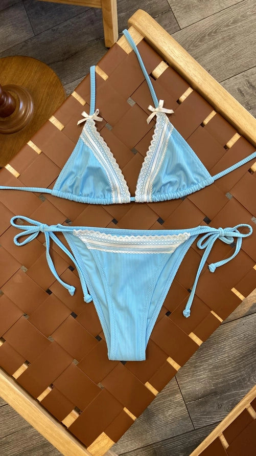 blue bikini with white lace trim