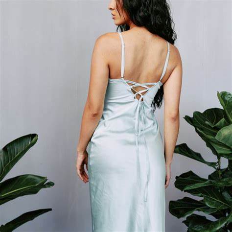 WOMAN IN GREEN SLIP