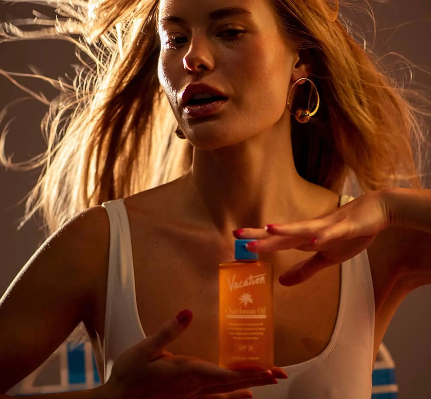 woman holding vacation oil