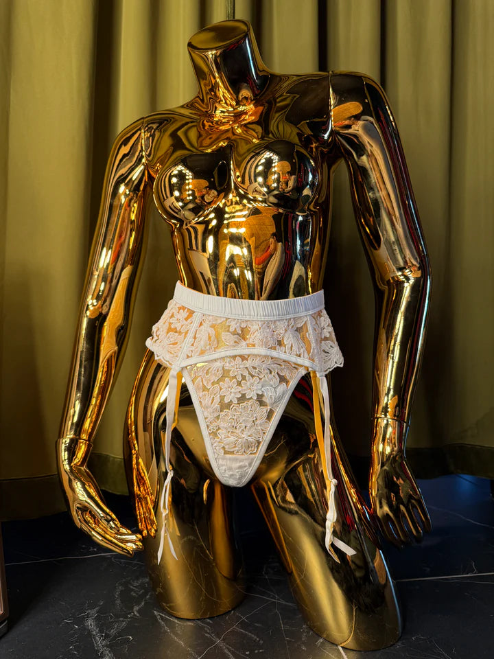 mannequin in white embroidery g-string