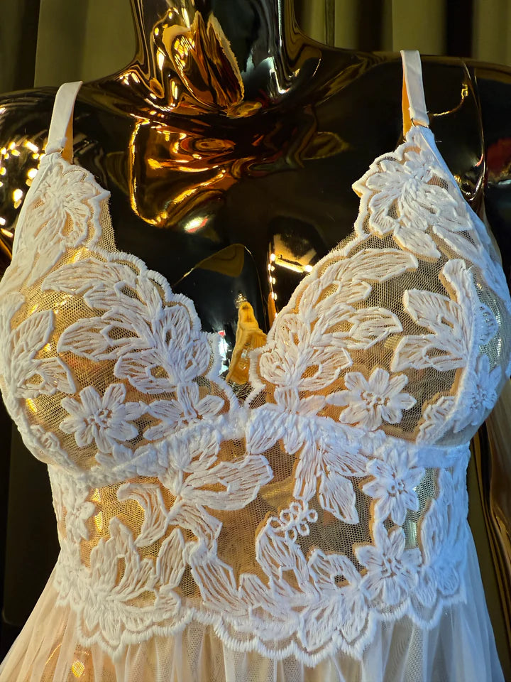 mannequin in white embroidery babydoll dress