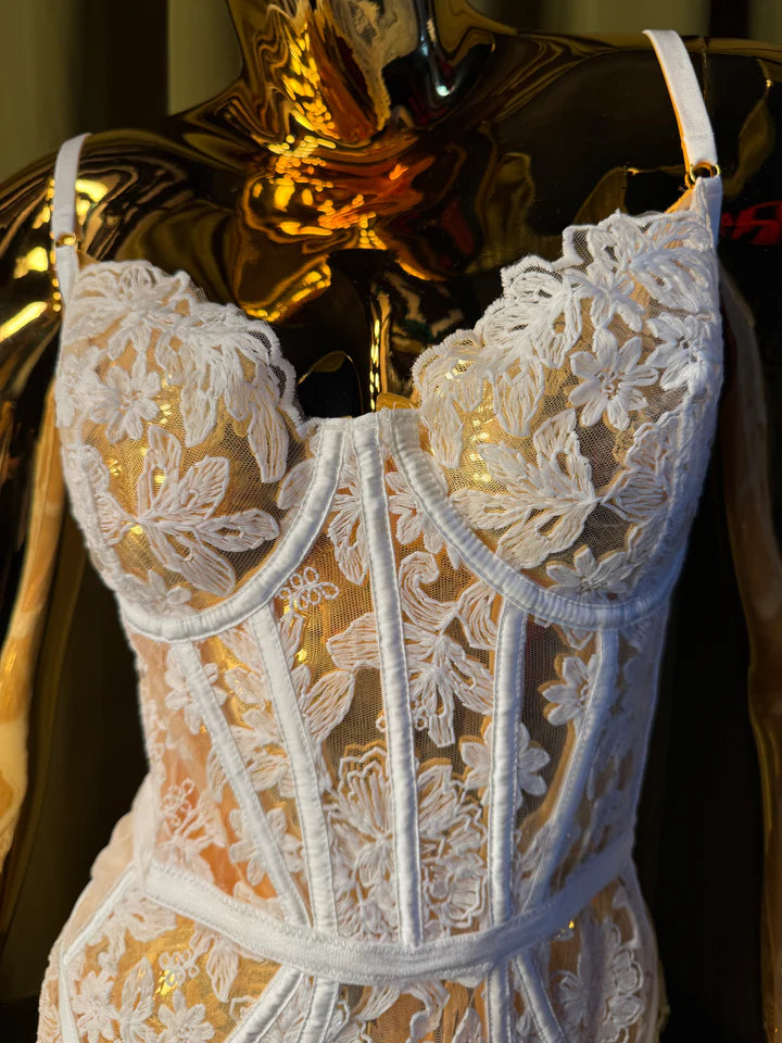 mannequin in white embroidery bodysuit