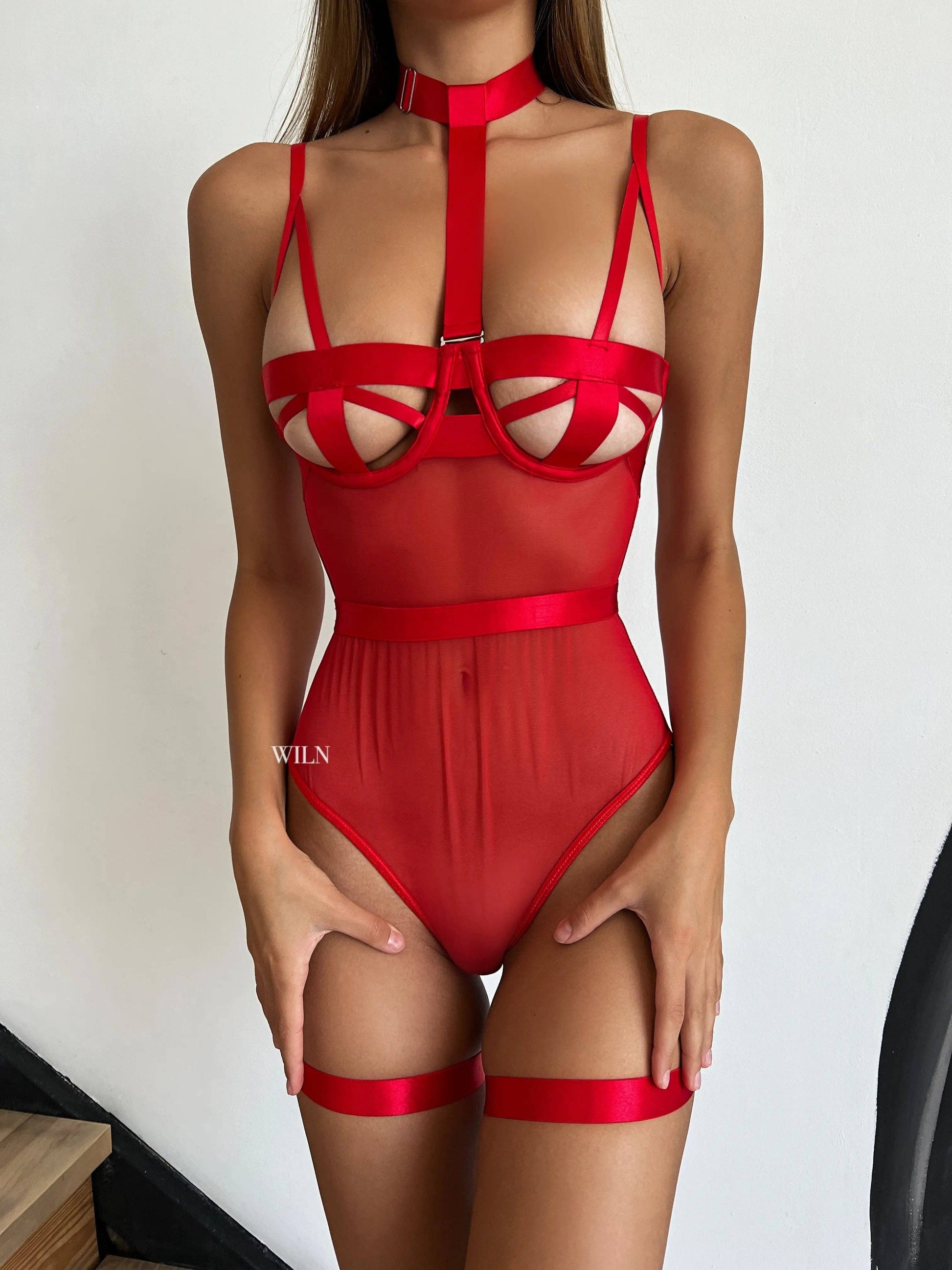 WOMAN IN RED BODYSUIT