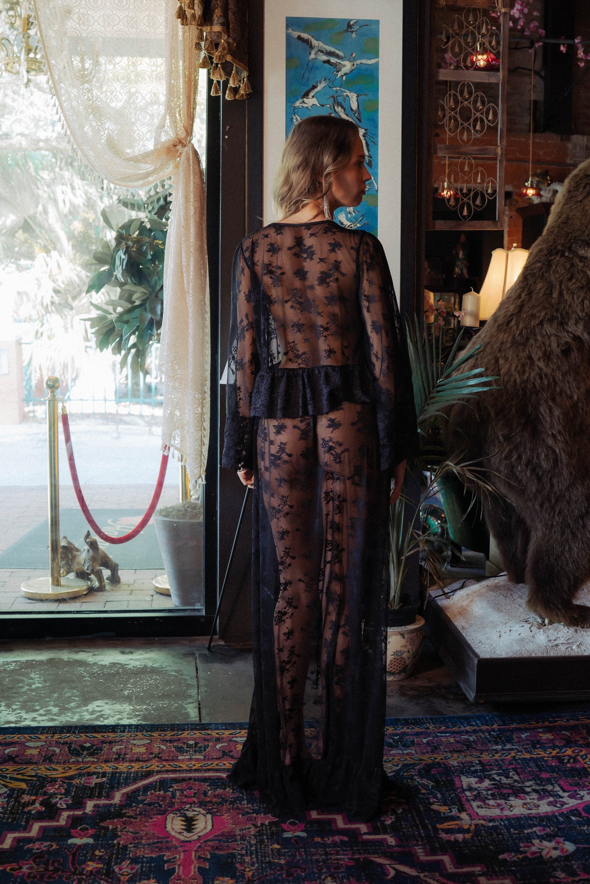 WOMAN IN BLACK LACE MAXI ROBE