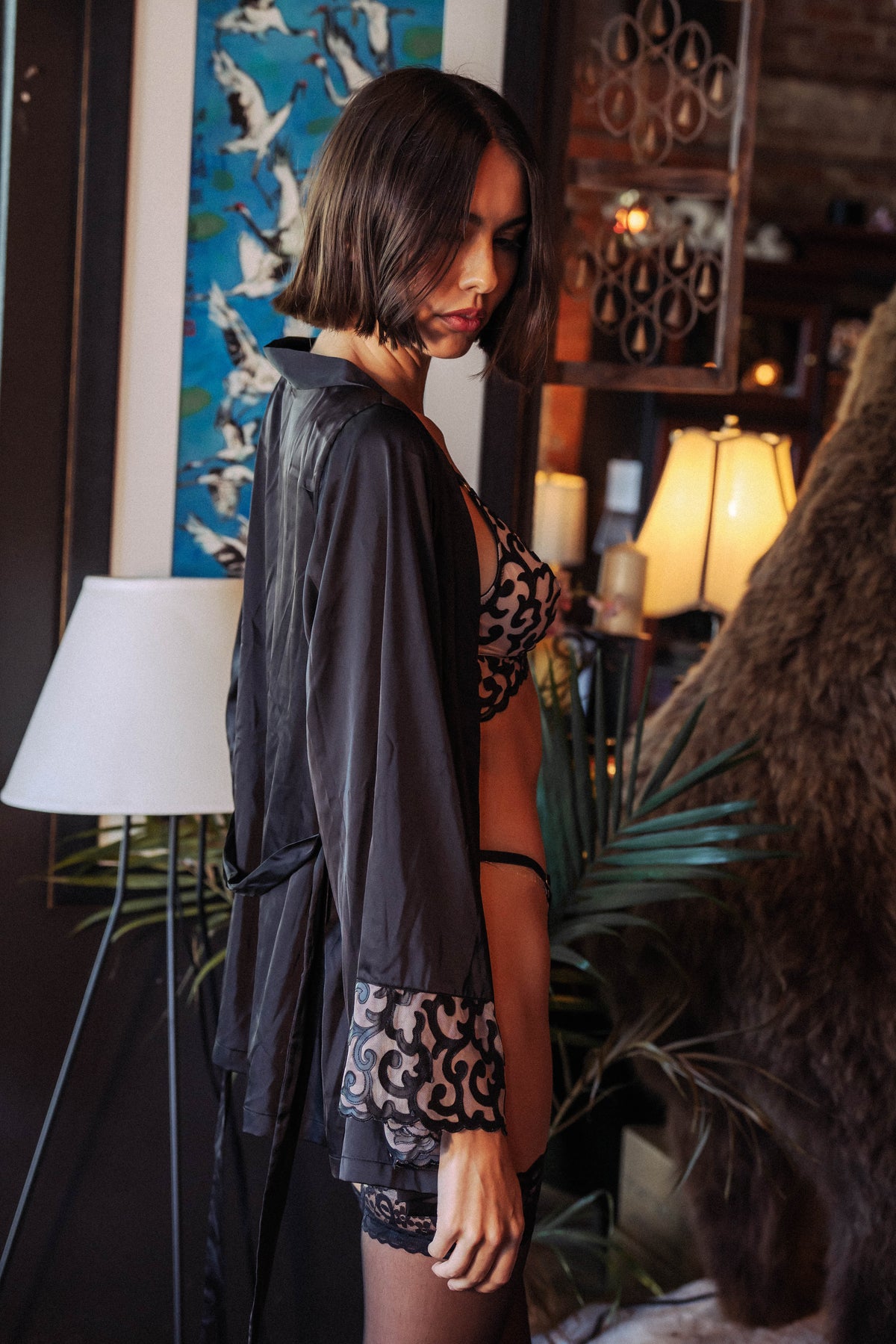 WOMAN WEARING EMBROIDERY-LASER CUT LEATHER SHORT ROBE