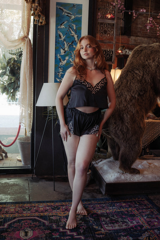WOMAN WEARING EMBROIDERY-LASER CUT LEATHER CAMI/BOXER SET