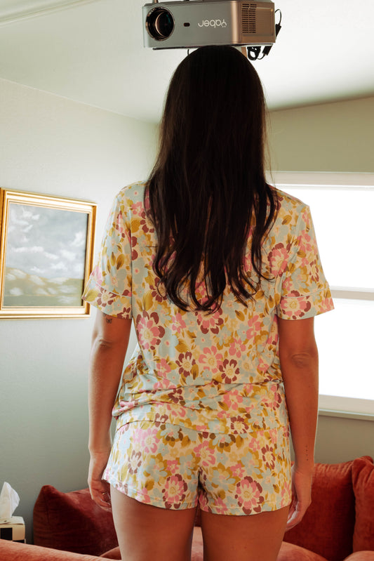 woman in floral printed PJ short set