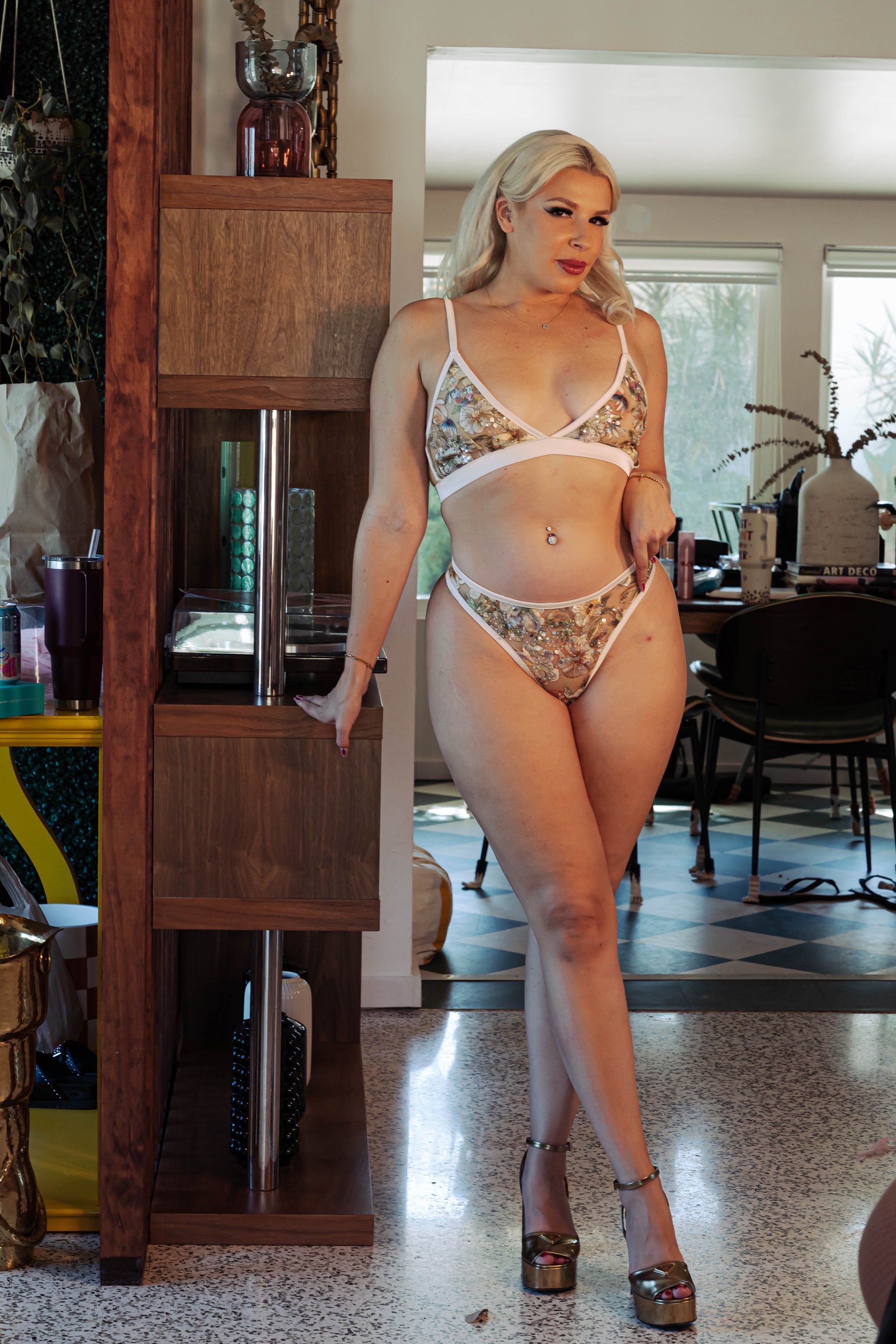 WOMAN IN BEIGE MESH BRALETTE AND THONG SET WITH SEQUIN EMBROIDERY