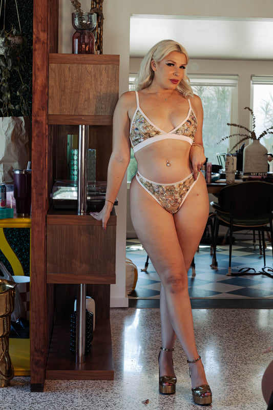 WOMAN IN BEIGE MESH BRALETTE AND THONG SET WITH SEQUIN EMBROIDERY