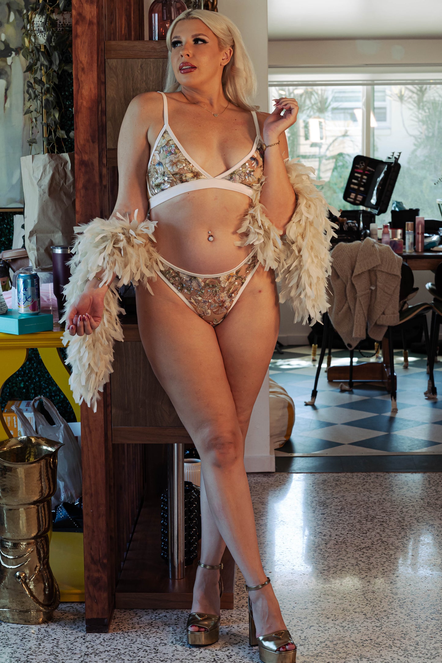WOMAN IN BEIGE MESH BRALETTE AND THONG SET THAT HAVE SEQUIN EMBROIDERY