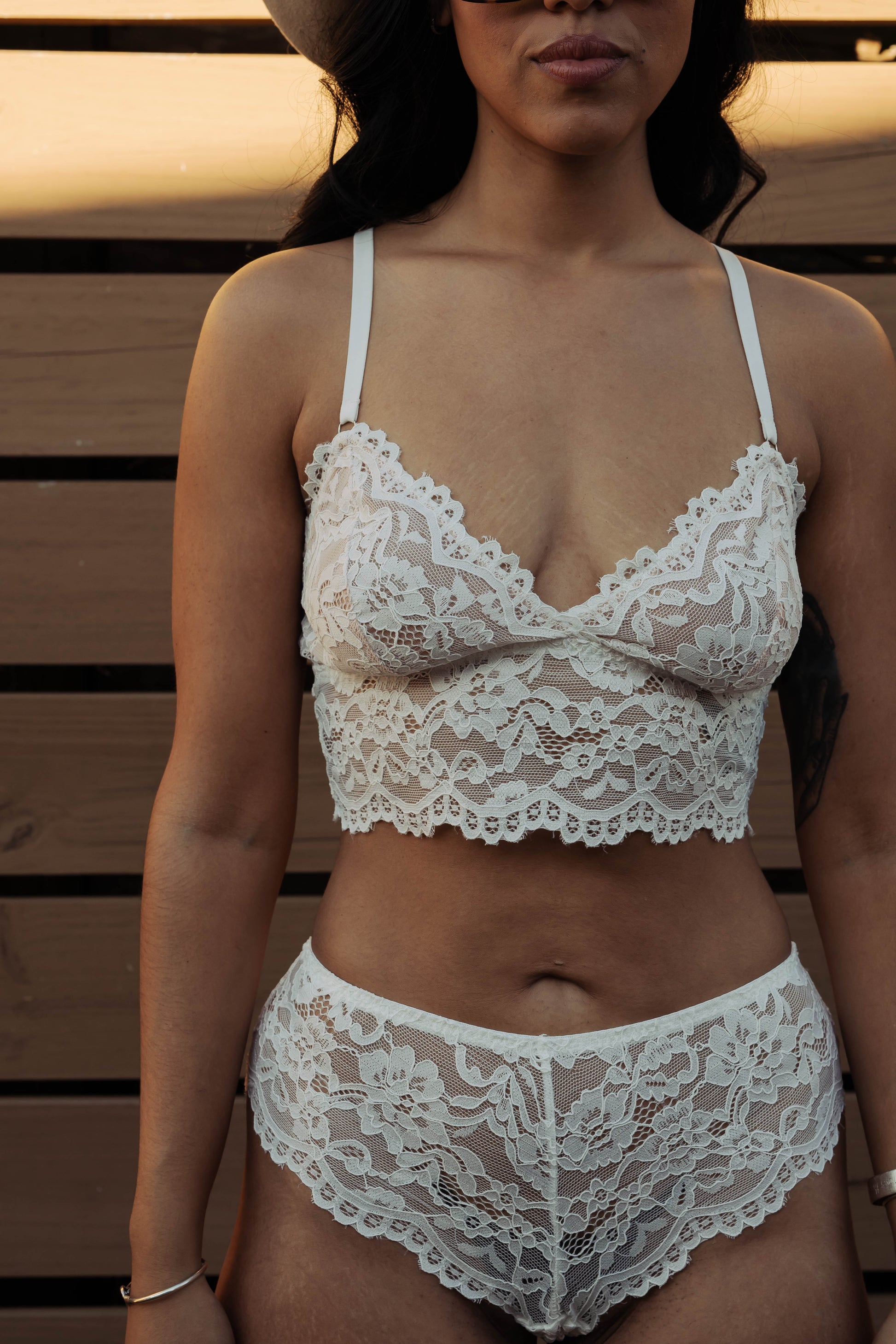 WOMAN IN WHITE LACE BRALETTE AND PANTY SET