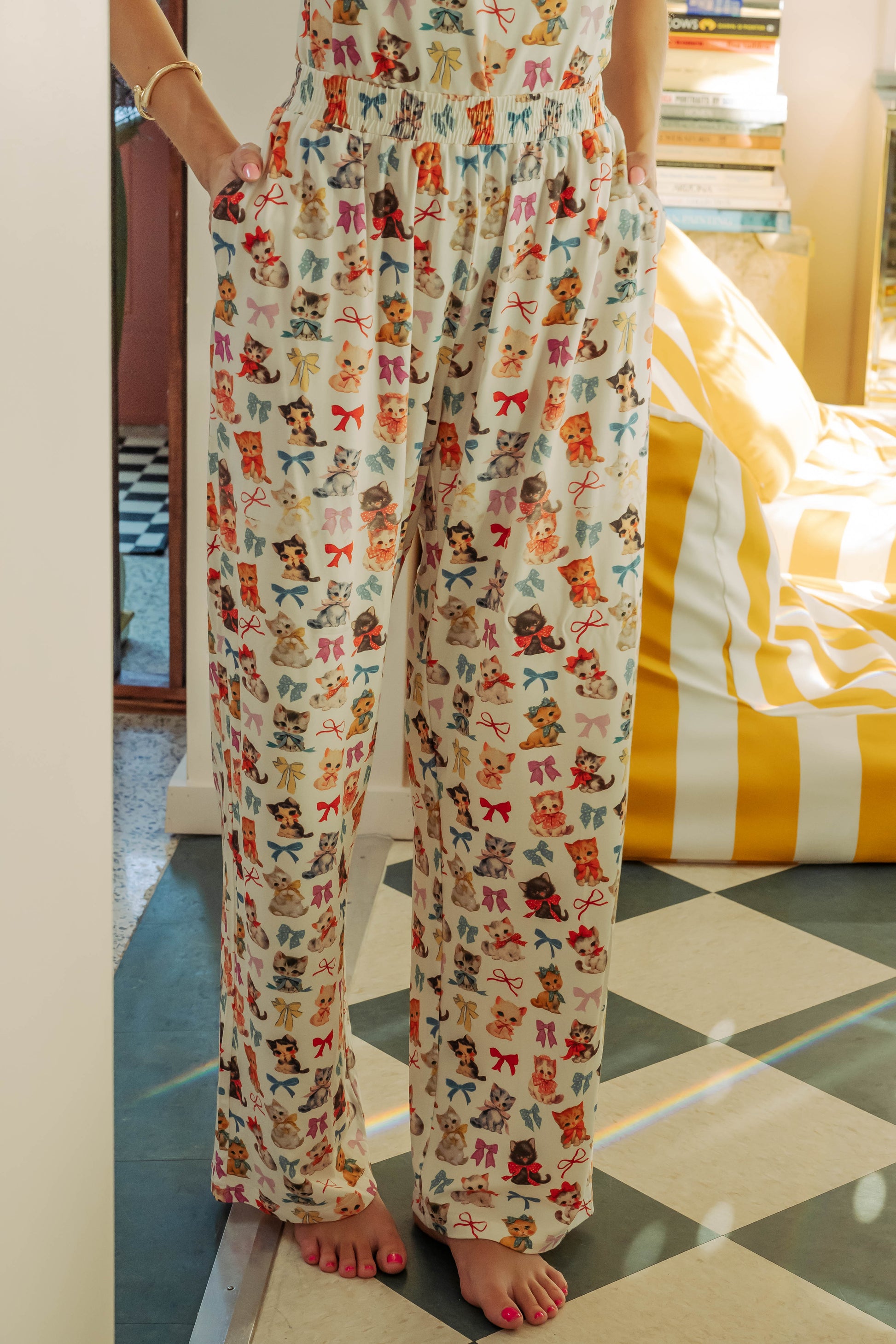 WOMAN IN KITTEN AND BOW PRINTED FLARE PANT AND CAMI 