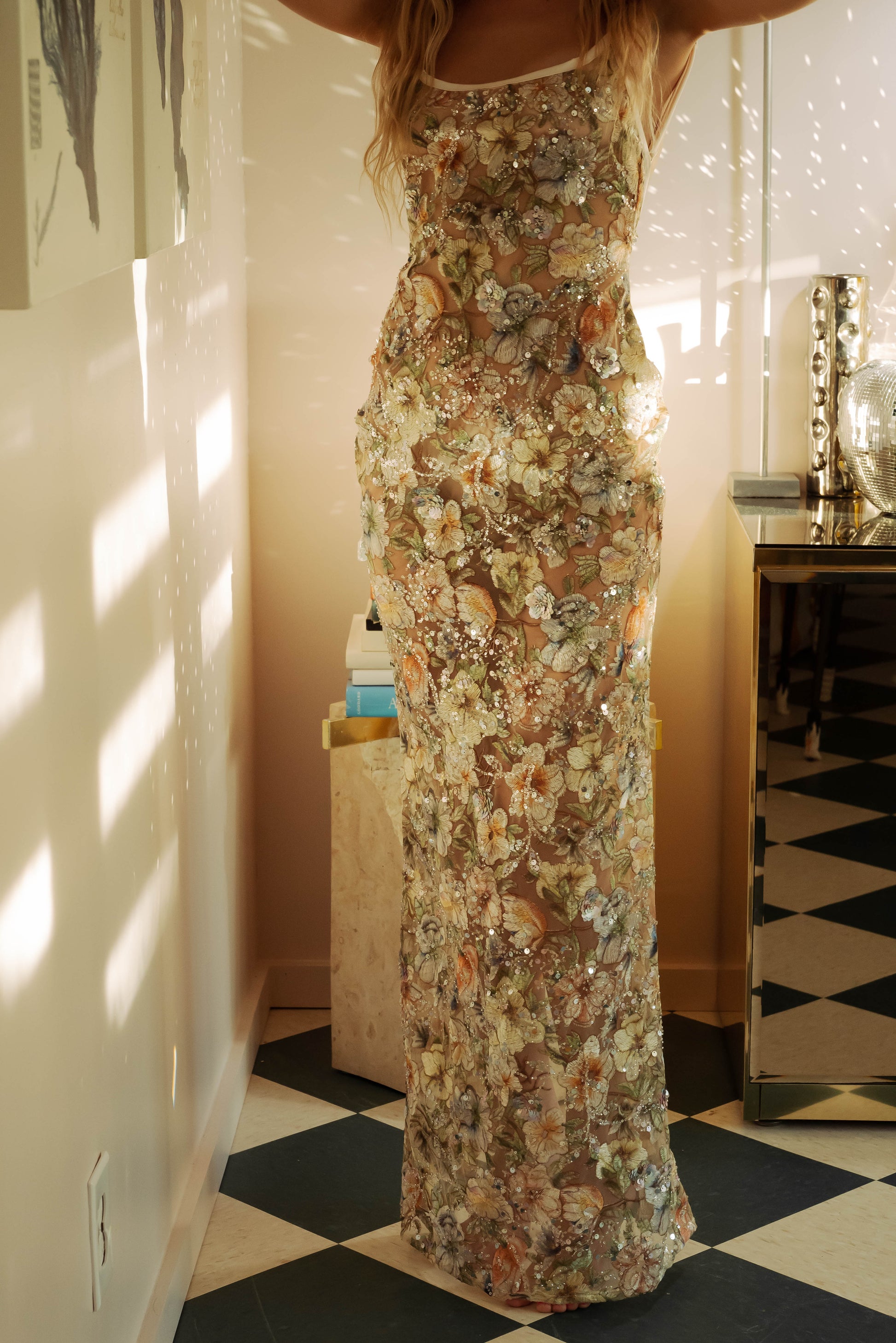 WOMAN IN MESH FLORAL DRESS WITH SEQUIN EMBROIDERY