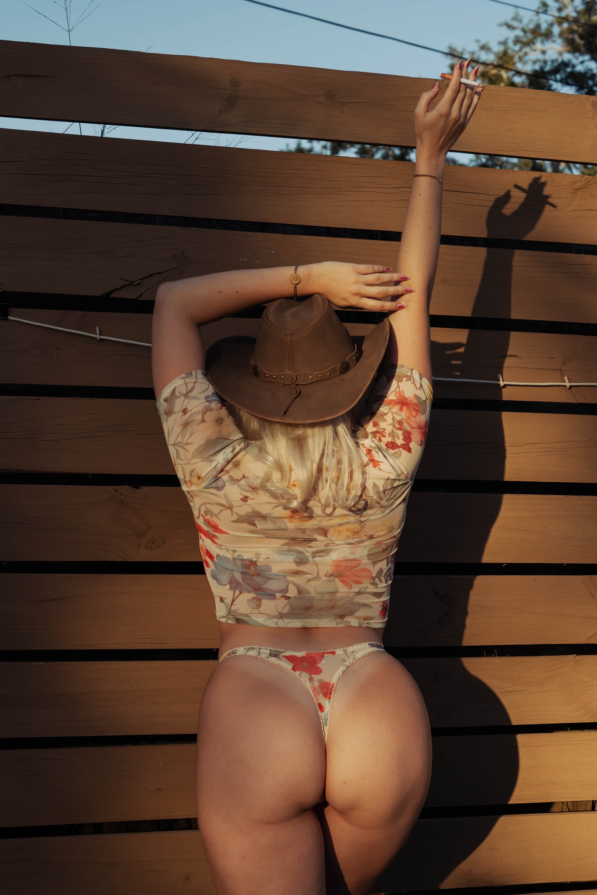 WOMAN IN FLORAL MESH BABY TEE AND MATCHING THONG