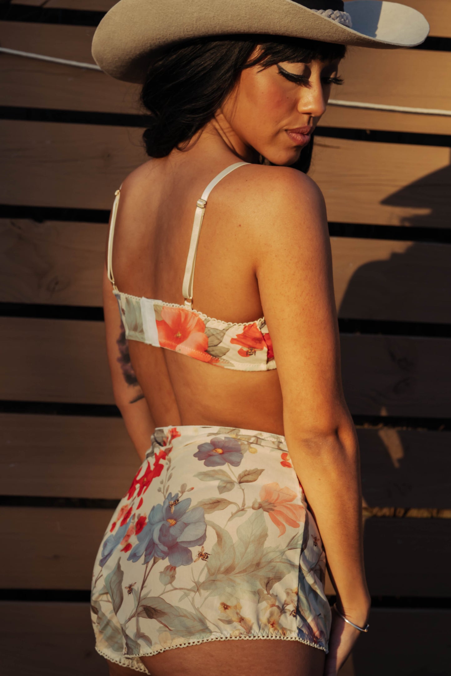 WOMAN IN FLORAL MESH SHORT AND BRALETTE SET
