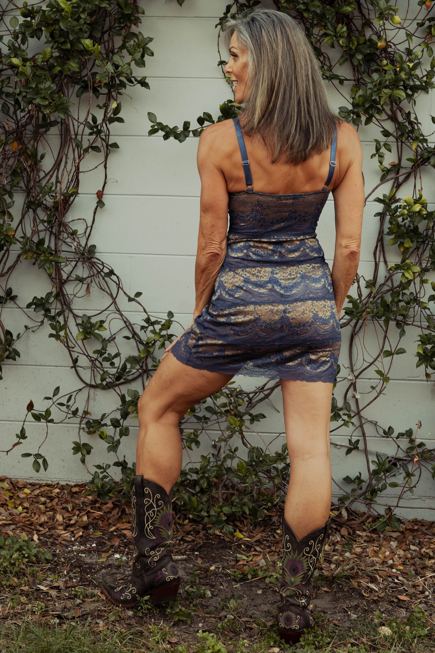 WOMAN IN BLUE AND GOLD LACE MINI SLIP