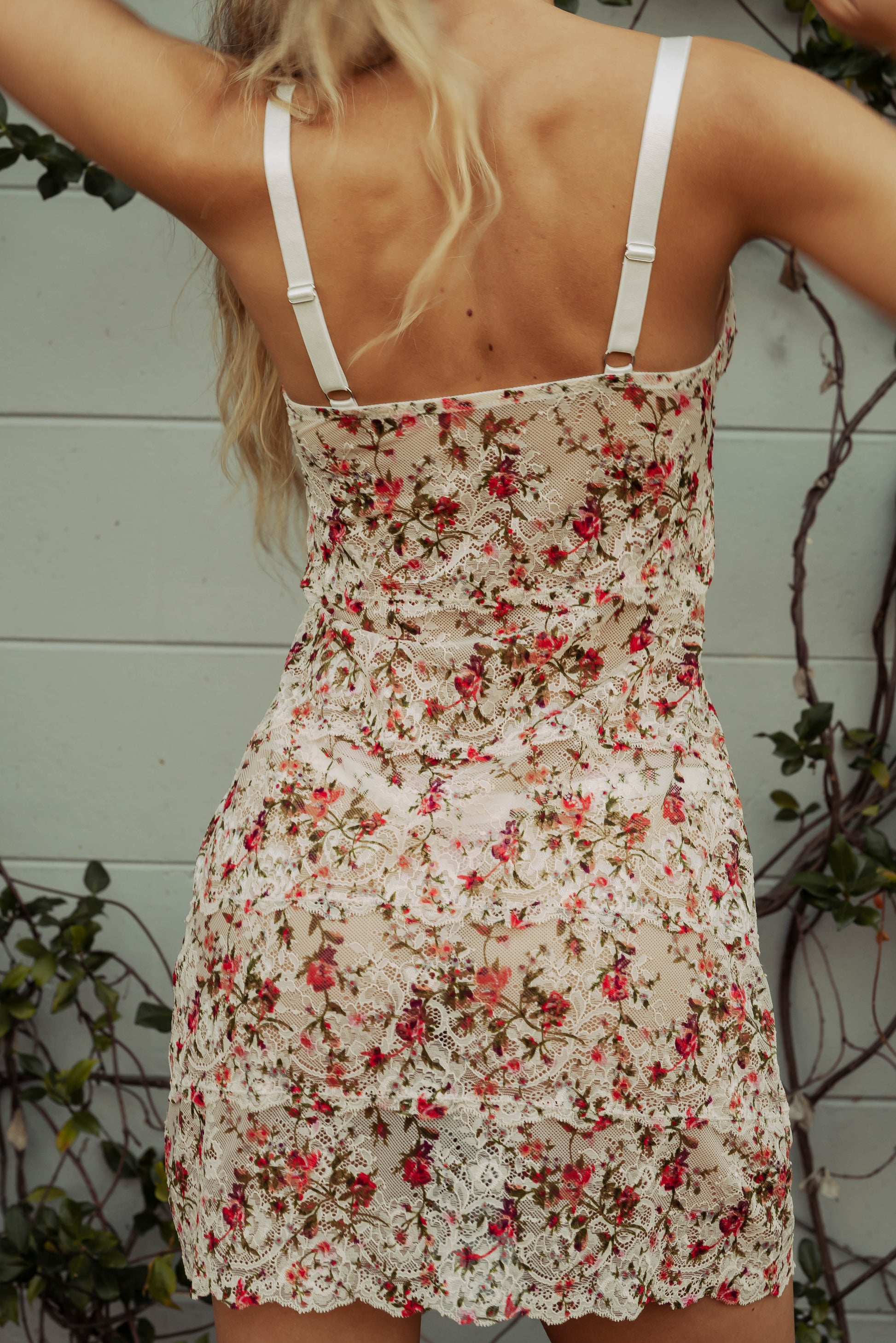 WOMAN IN FLORAL LACE MINI SLIP