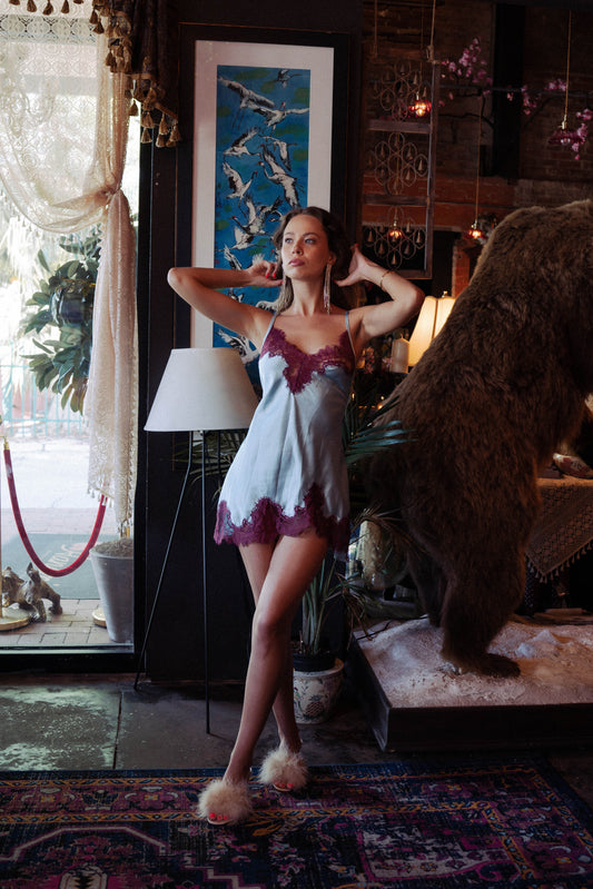 WOMAN WEARING ICY BLUE/PINOT MINI SLIP