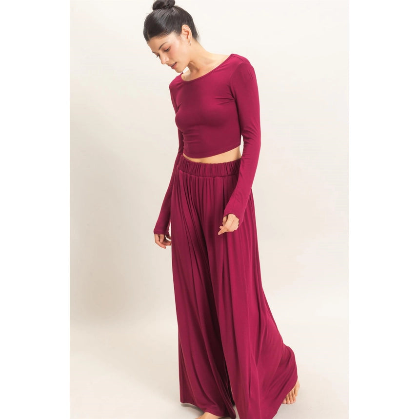 WOMAN MODELING LONG SLEEVE AND WIDE LEG PANT SET IN BURGUNDY