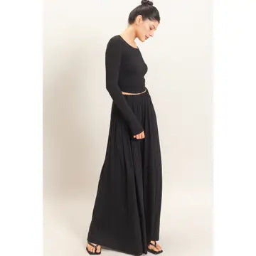 WOMAN MODELING LONG SLEEVE AND WIDE LEG PANT SET IN BLACK