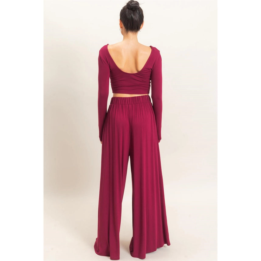 WOMAN MODELING LONG SLEEVE AND WIDE LEG PANT SET IN BURGUNDY