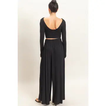 WOMAN MODELING LONG SLEEVE AND WIDE LEG PANT SET IN BLACK