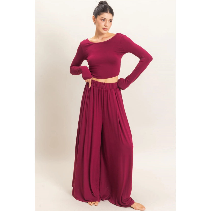 WOMAN MODELING LONG SLEEVE AND WIDE LEG PANT SET IN BURGUNDY