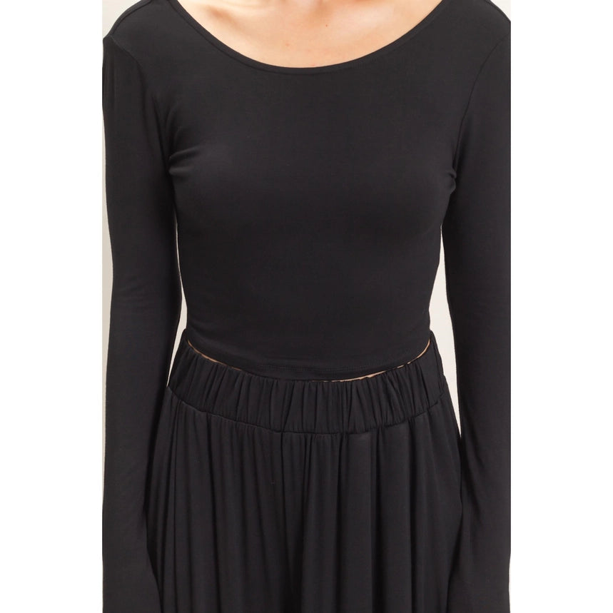 WOMAN MODELING LONG SLEEVE AND WIDE LEG PANT SET IN BLACK