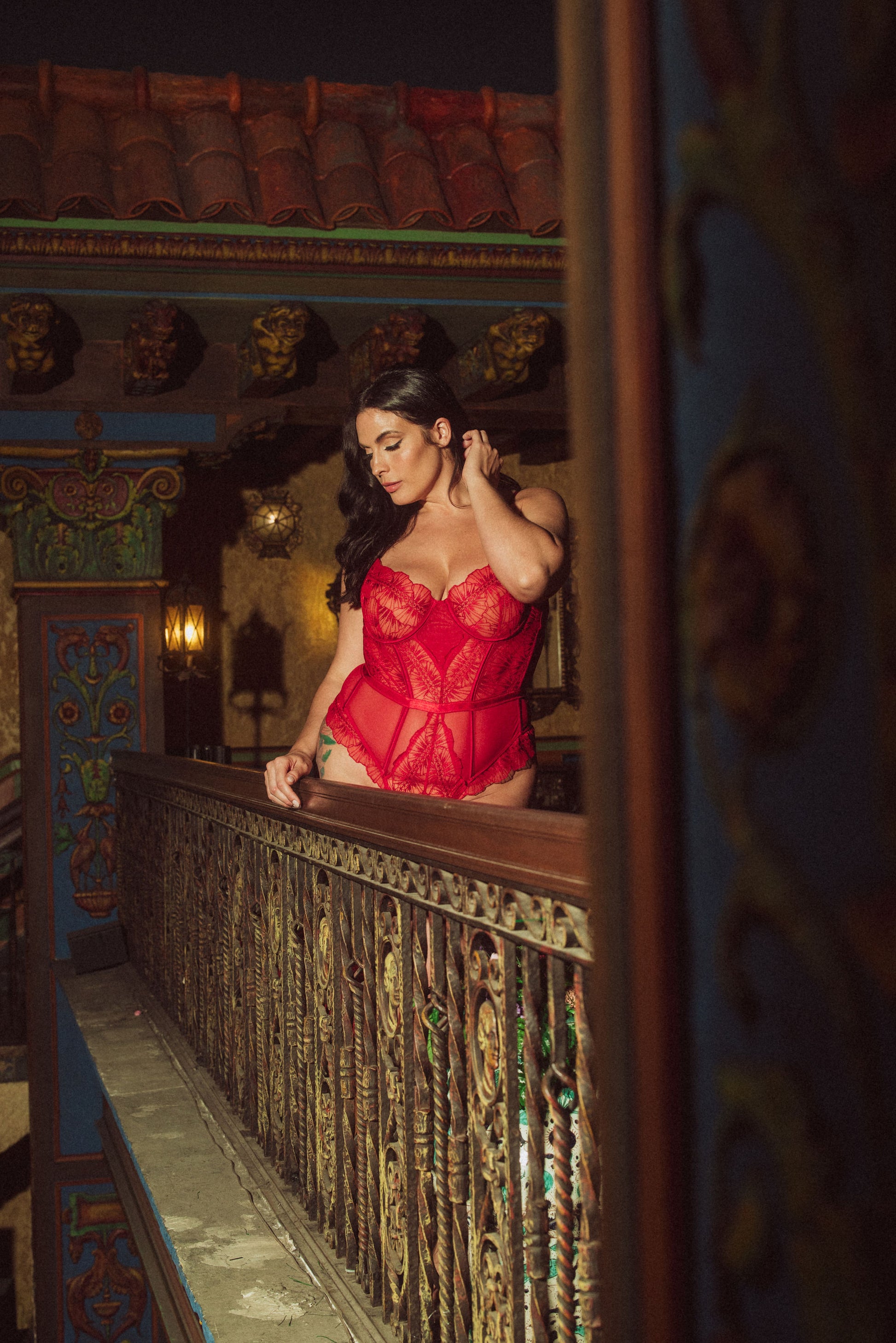 WOMAN IN  RED BODYSUIT 