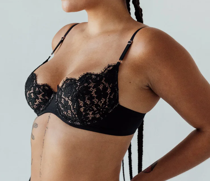 woman in black demi bra