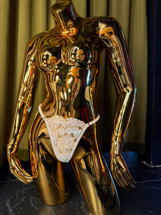 mannequin in white embroidery g-string