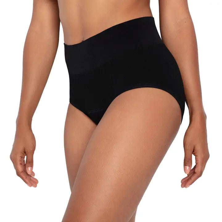 Person wearing black high-waisted underwear on a white background
