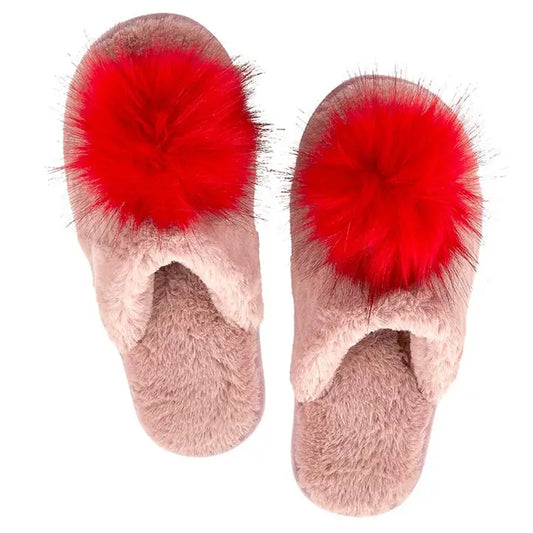 Pair of pink fuzzy slippers with red pom-poms